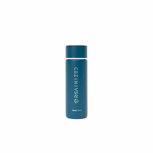 rogue_blue_1 – front view. Blue/teal cylindrical container with 'Orgainized' branding photographed on a white background