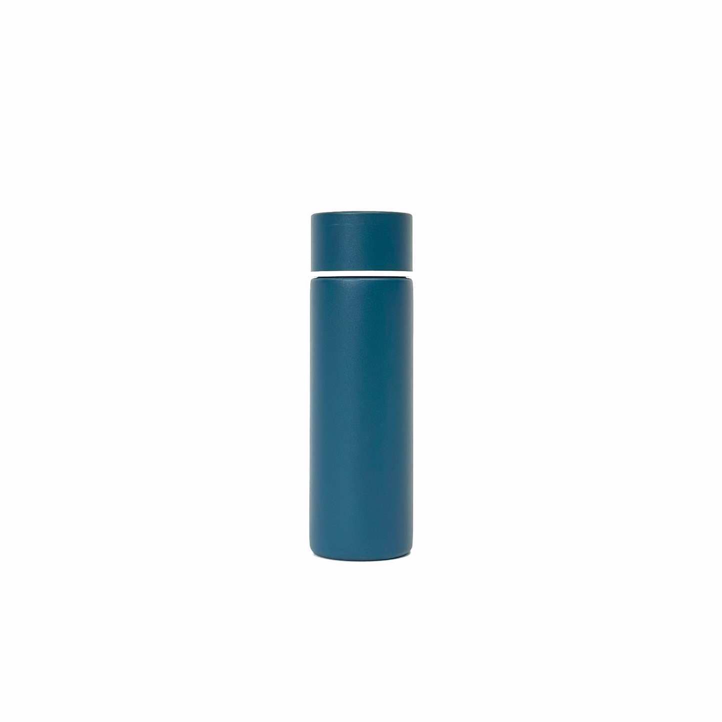 rogue_blue_4 – back view. Blue/teal cylindrical container photographed on a white background