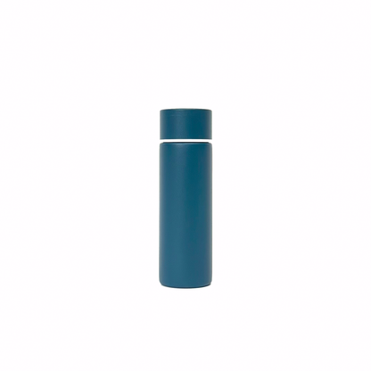 rogue_blue_4 – back view. Blue/teal cylindrical container photographed on a white background