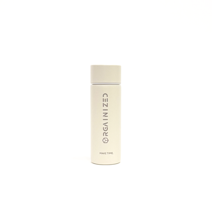white_sand_1 – front view. Off-white cylindrical container with 'Orgainized' branding photographed on a white background
