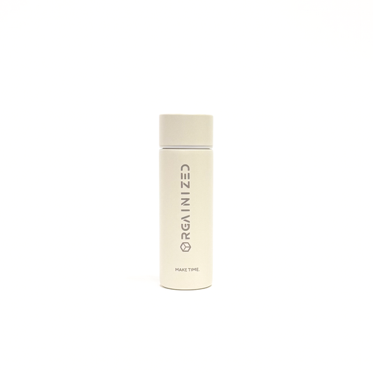 white_sand_1 – front view. Off-white cylindrical container with 'Orgainized' branding photographed on a white background