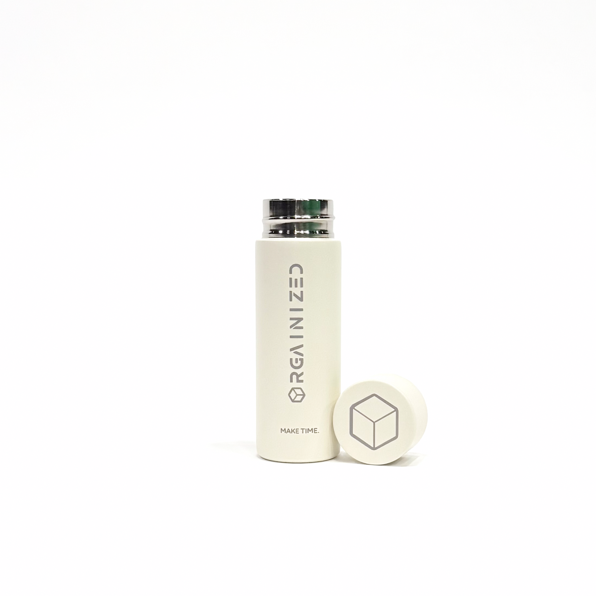 white_sand_3 – uncapped view. Off-white cylindrical container with 'Orgainized' branding photographed with the lid removed on a white background